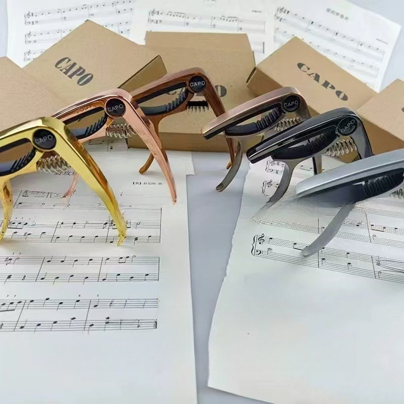 Musical Instrument Ending In A - คาโป้กีตาร์ คาโป้กีตาร์ไฟฟ้า กล่องสีสวยงาม บรรจุภัณฑ์คุณภาพสูง อุปกรณ์เสริมกีตาร์ คลิปหนีบกีตาร์